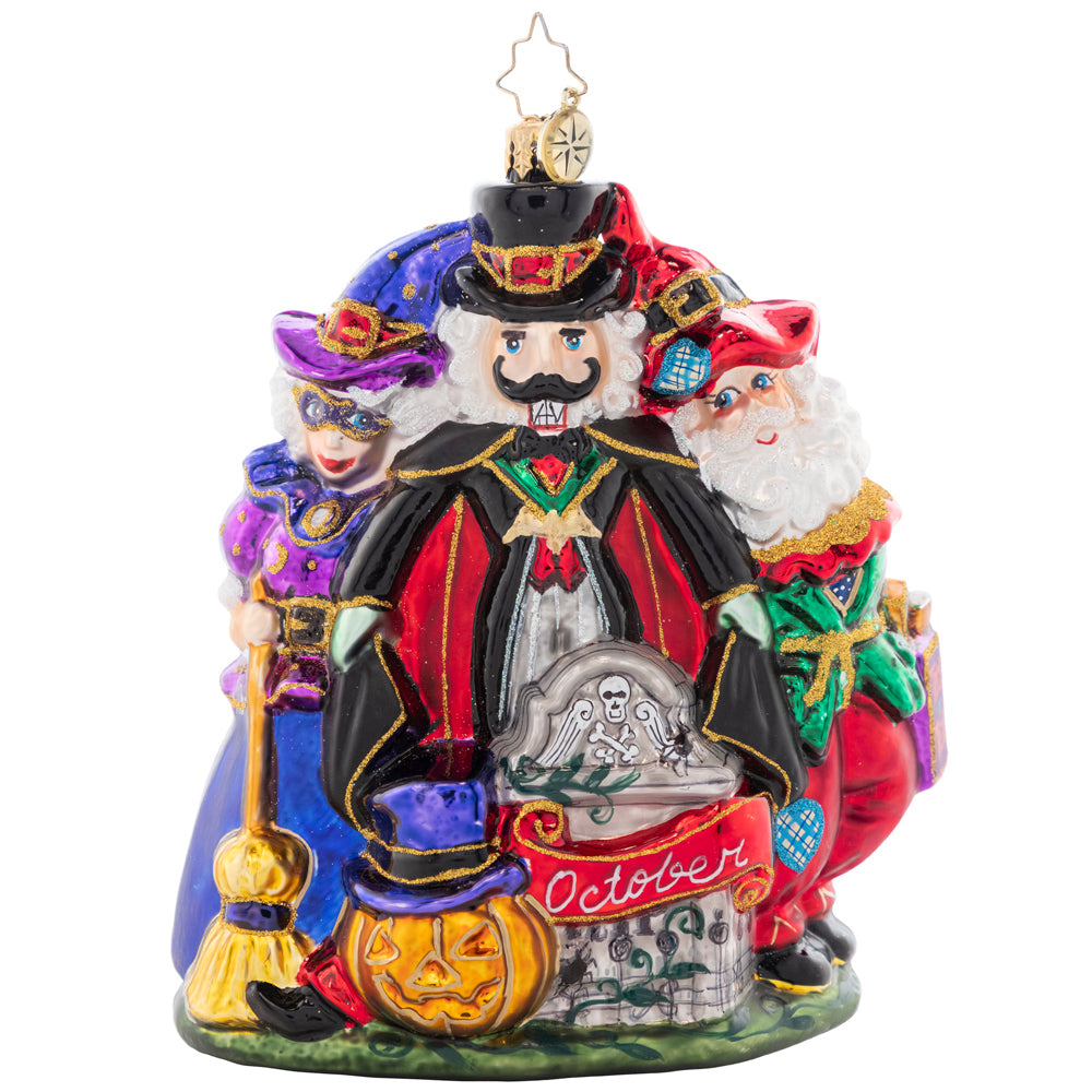 Front - Ornament Description - Happy Hauntings: It's looking like a holiday-themed Halloween! Santa, Mrs. Claus, and a spooky nutcracker celebrate with fright and delight for the tenth piece in our Ornament of the Month collection.