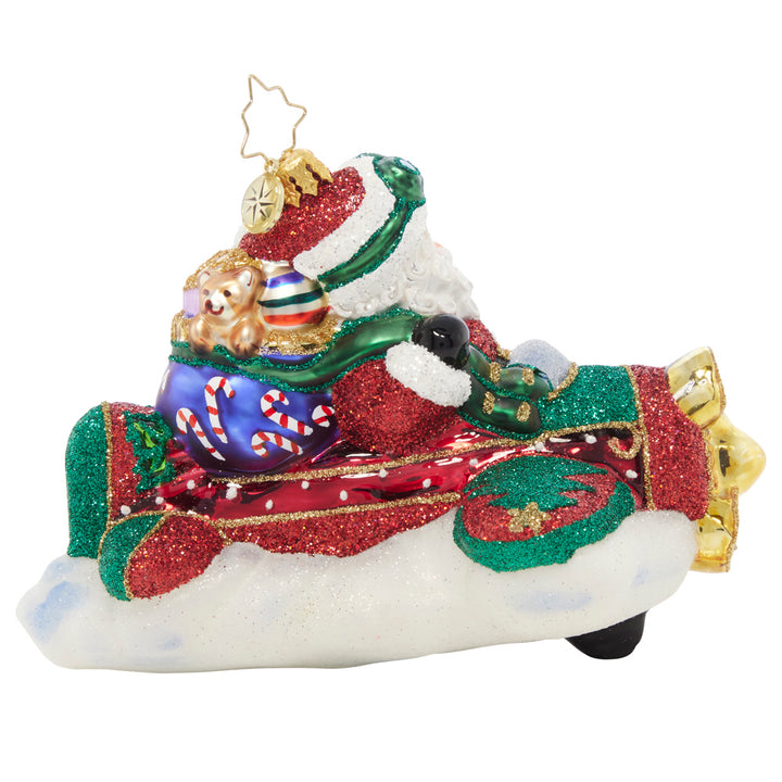 Back - Ornament Description - This Year is Flying By: Santa is taking to the skies in a different type of ride for the New Year…he's switching out his signature sleigh for a one-man plane!