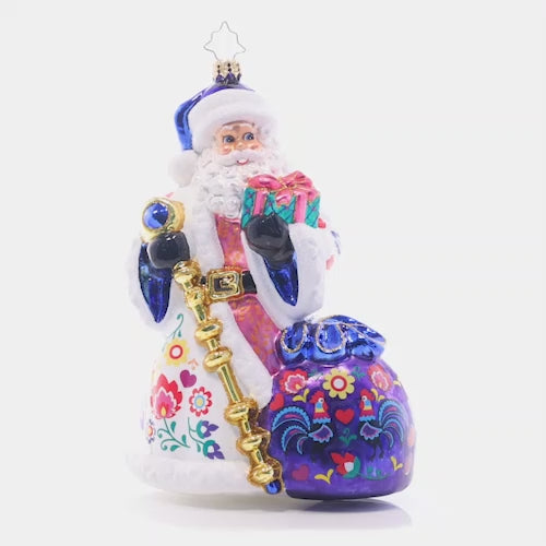 Video - Ornament Description - Floral Folk Santa: Santa is looking festive as ever in a cozy ensemble fashioned in the style of floral European folk art. Uniquely colorful and hand-painted with care, this piece is a truly unique addition to your collection.