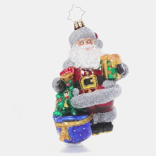 Video - Ornament Description - Shimmering With Surprises: Who needs tinsel? Santa's puttin' on the glitz with the twinkling silver trim on his plush red suit. With an outfit like this, he sparkles as bright as any Christmas tree! This video shows the ornament slowly spinning. 