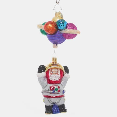 Video - Ornament Description - Santa in Space: 3…2…1…blast off! Santa is exploring the final frontier of space, bravely going where no elf has gone before! He grins from inside his space suit, dangling from a cluster of colorful planets. This video shows the ornament spinning slowly. 