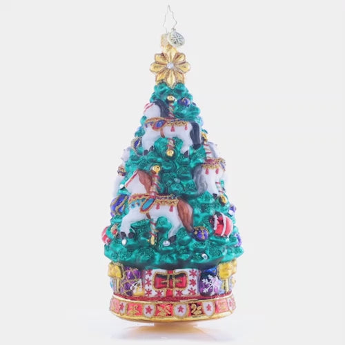 Video - Ornament Description - Carousel Christmas Tree: As the carousel tree spins round and round, the sparkling horses twinkle among toys abound. Adorn your tree with this whimsical piece, and remember the joy of a classic carousel ride.