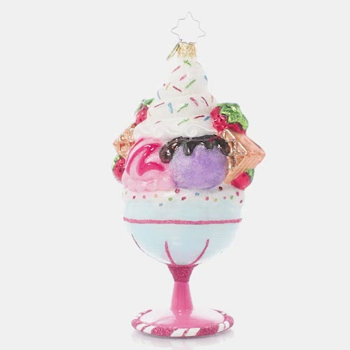 Video - Ornament Description - Cherry on Top: Now that's what I call a sundae! Generous scoops of ice cream, dollops of whip cream, waffle cone pieces, fresh fruits, sweet syrups and loads of sprinkles fill a candy-colored goblet to create a treat that sweet dreams are made of.