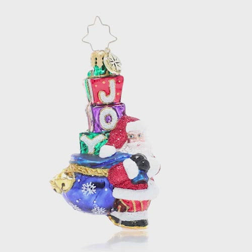 Video - Ornament Description - Joyous Saint Nick Gem: Santa's his name, and JOY is his game! Everyone's favorite elf carries a sack piled high with surprises, primed to spread Christmas cheer to one and all. This video shows the ornament slowly spinning. 