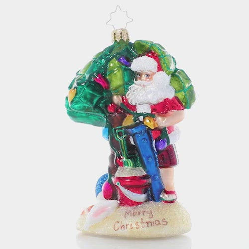 Video - Ornament Description - Sandy Claus: Santa's officially out of office! He's packed a beach bag and escaped to the islands for a little fun in the sun after a very busy Christmas season. This video shows the ornament spinning slowly. 