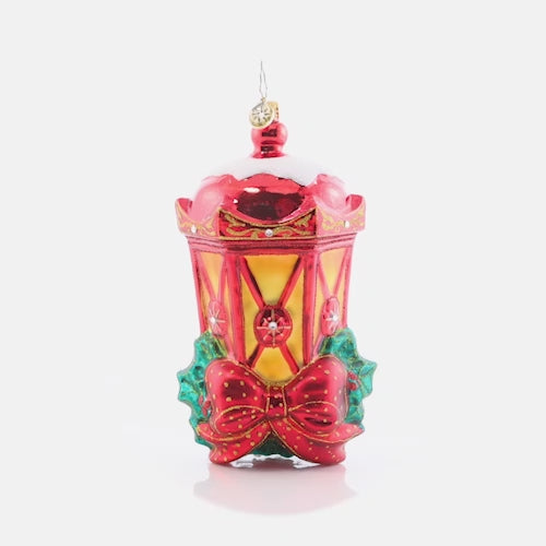 Video - Ornament Description - Holiday Glow: This lantern is bright with a glowing light, ready to guide you through the night. A perfect piece to bring warmth and classic holiday style to your Christmas tree. This video shows the ornament slowly spinning. 