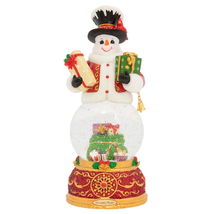 Snowglobe Description - Snowy Tidings: Our frosty friend is always dreaming of a white Christmas. And this year, his wishes have all come true! The whole town is covered in a blanket of fresh, powdery snow. Enjoy this scenic snowglobe and sing along as it plays the classic holiday tune, "Let It Snow."