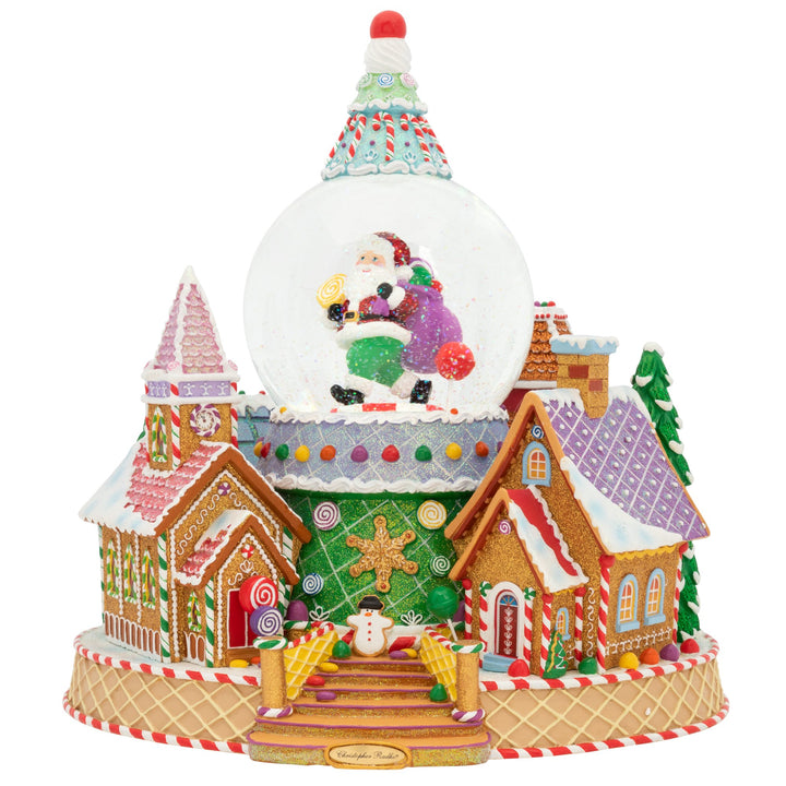Snowglobe Description - Ginger Village Delight: From the roof, to the entryway, and all the way down to the door knockersâ€”everything in this ginger village is made entirely of candy! The prospect of staying in this ultra-sweet land forever sounds downright dandy. Celebrate the sweet side of the holidays with this mouthwatering snowglobe. It even plays the classic Christmas tune, "Toyland" and blows snow!