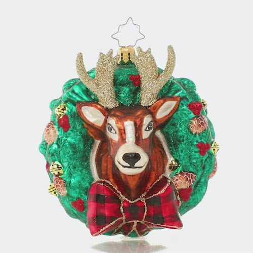Video - Ornament Description - Rustic Reindeer Wreath: Dasher or Dancer, Prancer or Vixen? One of Santa's trusted regular-nosed reindeers peeks through a holiday wreath in this festive ornament. This video shows the ornament spinning slowly. 