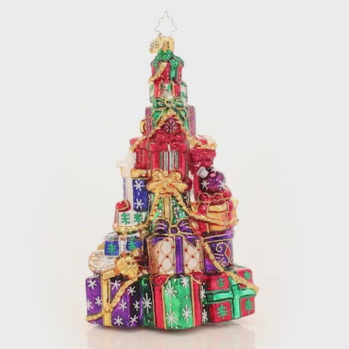 Video - Ornament Description - Abounding Presents: Someone has been VERY good this year! This supersized pile of presents seems to get higher with every Christmas that goes by!