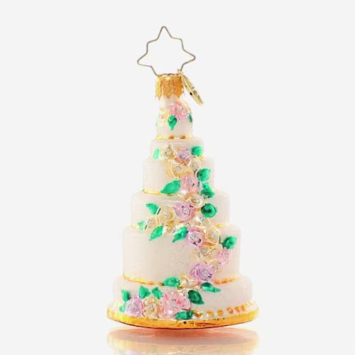 Video - Ornament Description - Six-Tier Celebration Gem: Be the envy of every baker with this towering tiered cake ornament. Decorated with a cascade of colorful spring blooms, it's lucky that it's the kind of cake that will last year after year because this piece is almost too beautiful to eat! This video shows the ornament spinning slowly. 