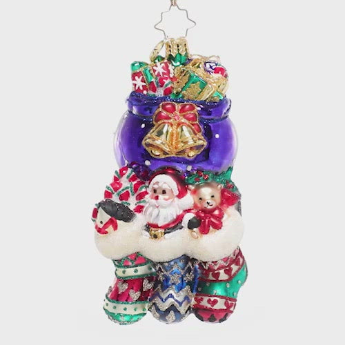 Video - Ornament Description - Santa Was Here!: There's no doubting that Saint Nick has paid a visit to this chimney. He's stuffed all the stockings full of surprises for three very good children on Christmas morning! This video shows the ornament spinning slowly. 