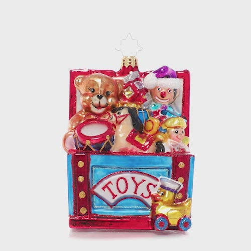 Video - Ornament Description - Treasured Toybox: Open the lid and who knows what surprises await you inside! This vibrant toy chest is filled to the tippy top with Christmas treasures for every good girl and boy. This video shows the ornament spinning slowly. 