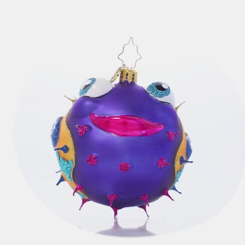 Video - Ornament Description - All Puffed Up: Poof! This colorful pufferfish is all smiles as she shows off her secret talent. Hang her on your tree for a touch of tropical flair!