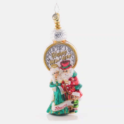 Video - Ornament Description - In With the New: Santa and Mrs. Claus revel in cheer as they commemorate the start of a brand new year. The premier piece in our Ornament of the Month collection celebrates an exciting start to a wonderful year! This video shows the ornament slowly spinning, 