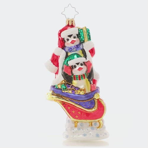 Video - Ornament Description - Silliest Sleigh Ride: A pair of polar pals is up to their tricks again, playing a little dress-up as they load Santa's sleigh for round-the-world deliveries. Good thing Santa has a sense of humor! This video shows the ornament spinning slowly. 