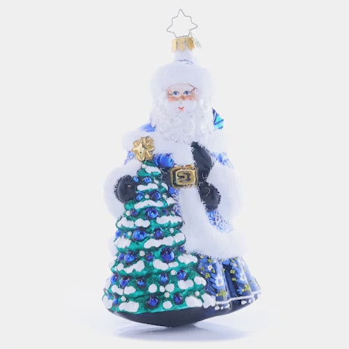 Video - Ornament Description - Winter Hues Santa: Dressed from head-to-toe in cool winter blues, Santa totes a splendid giftsack embellished with intricate snowflakes. Even his noble fir tree is trimmed in blue! This video shows the ornament spinning slowly. 