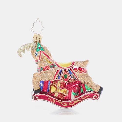 Video - Ornament Description - The Buck Rocks Here Gem: Who's that gliding through the snow? A holiday rocking-deer, that's who! This delightful little fellow prances atop a pile of pretty presents, ready to leap into your holiday home. This video shows the ornament spinning sloely. 