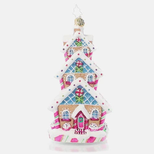 Video - Ornament Description - Sweetest Highrise: This charming tri-level treat is triple the fun! Covered in Christmas candies and icing snow drifts, this charming gingerbread cottage shows off some of what makes this season so very sweet. This video shows the ornament spinning slowly. 