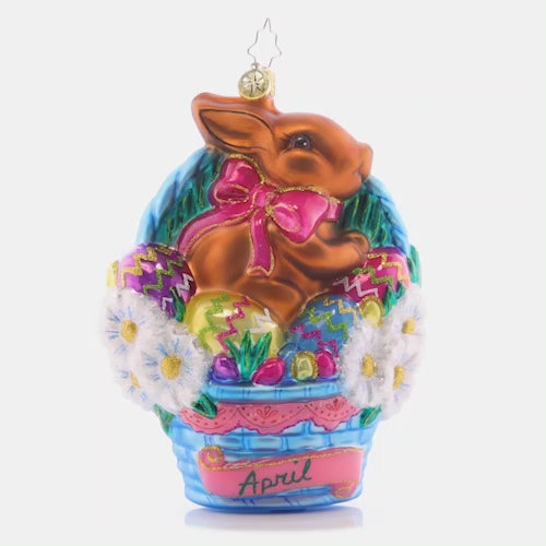 Video - Ornament Description - Happy Easter: The fourth piece in our Ornament of the Month collection will have you hippity-hopping for joy! A blushing bunny has leapt into an Easter basket, joining the hunt for candy-filled eggs. This video shows the ornament slowly spinning. 