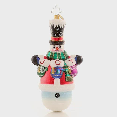 Video - Ornament Description - Crochet All Day!: Who knew you could knit with mittens on? Frosty has been hard at work making cozy gifts for his loved ones! This special ornament has been hand-picked by the Radko team to be part of the Limited Edition collection. The ornament spins slowly in the video.