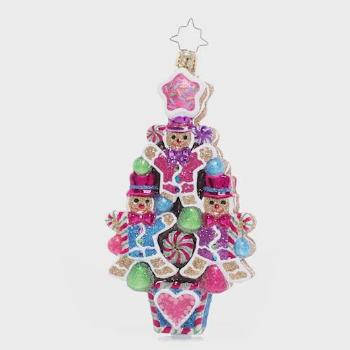 Video - Ornament Description - The Sweetest Treats: Treats on treats! These little gingerbread fellows have stacked themselves up in a jewel-toned festive formation – a sweet cookie Christmas tree! This video shows the ornament spinning slowly. 