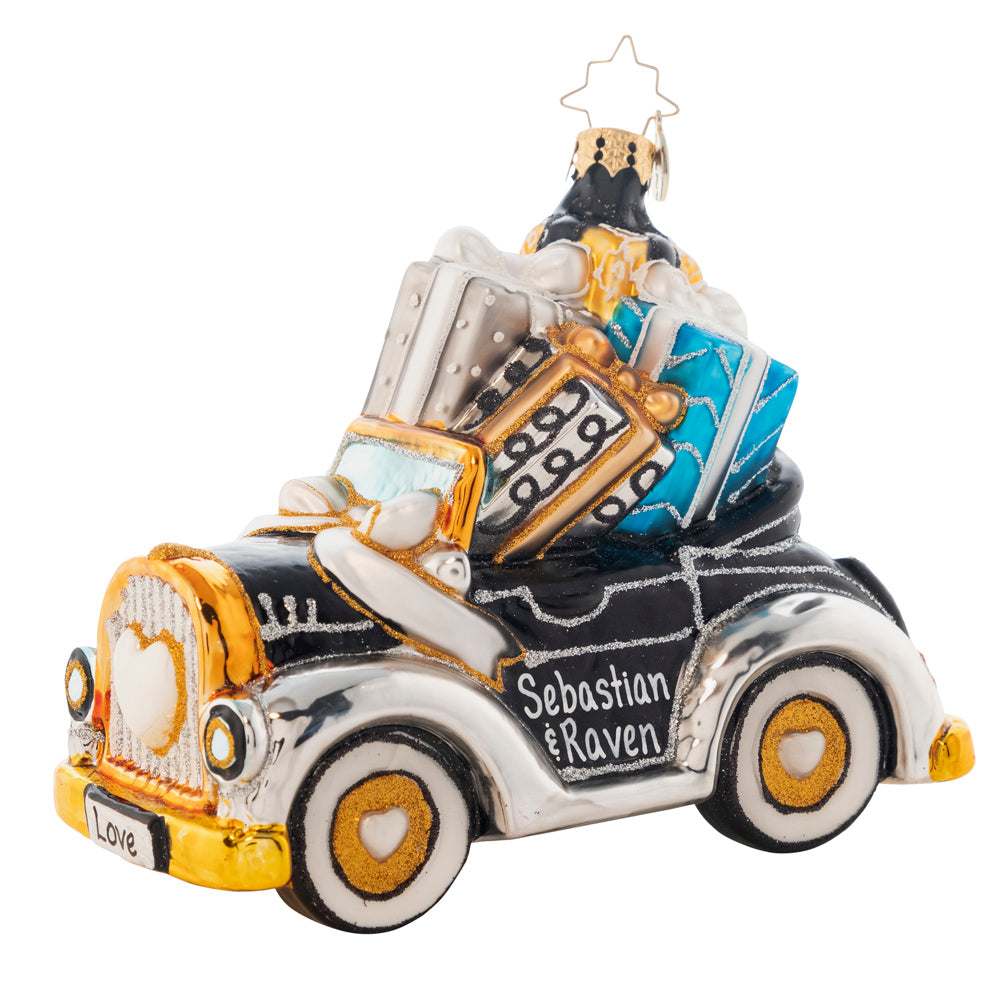 Ornament Description - Gifts On The Way: Getting hitched? This 2018 gorgeously gift-filled convertible is just waiting for you and your loved one to put your names on it! The adorable front license plate is dated 2018. Note: Please allow approximately one month (on top of shipping time) for our elves to personalize your ornament.