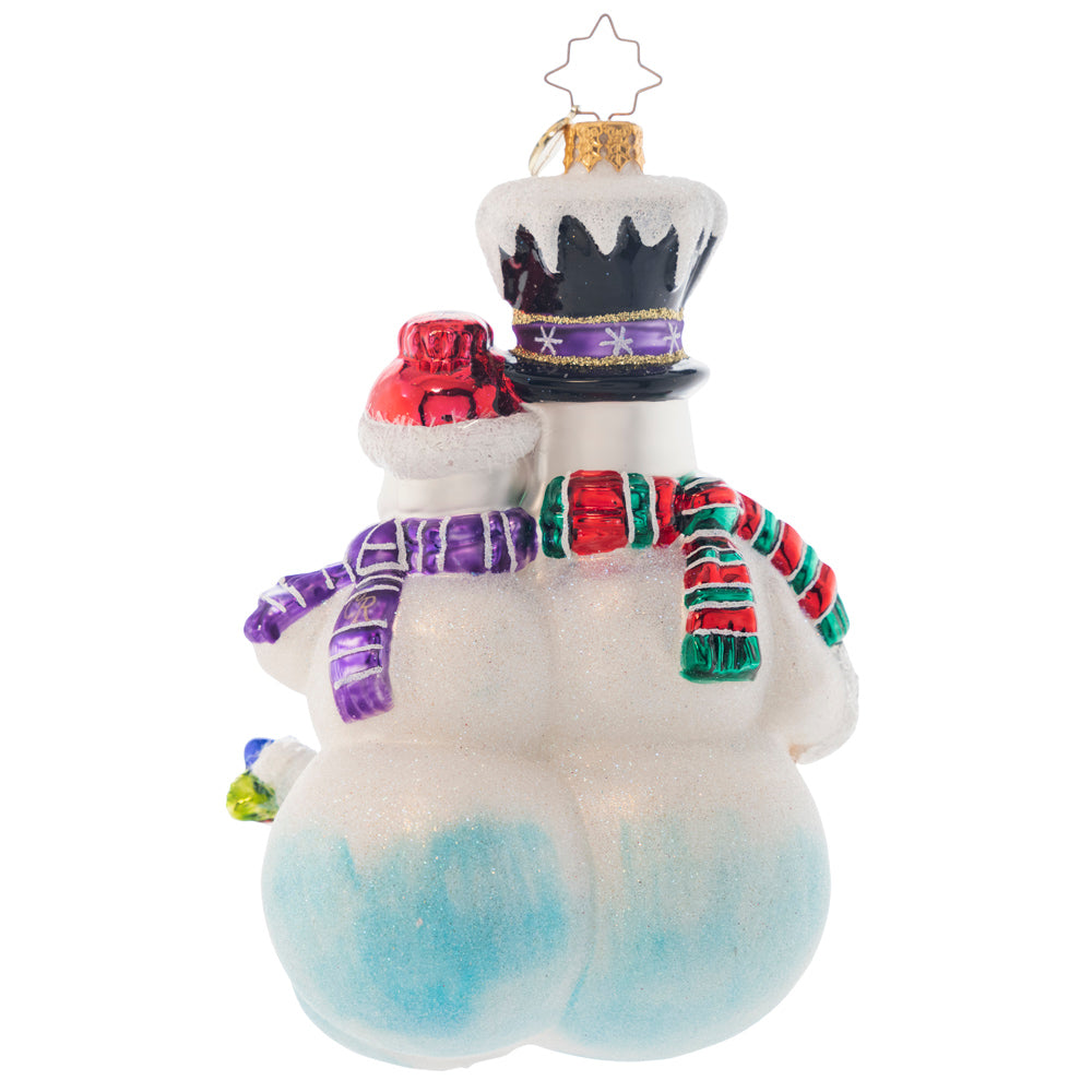 Back - Ornament Description - Merry Christmas From The Frosts: This darling snow family is as happy as can be! Show the love in your home by personalizing the bright red heart with the names of your family members. Note: Please allow approximately one month (on top of shipping time) for our elves to personalize your ornament.