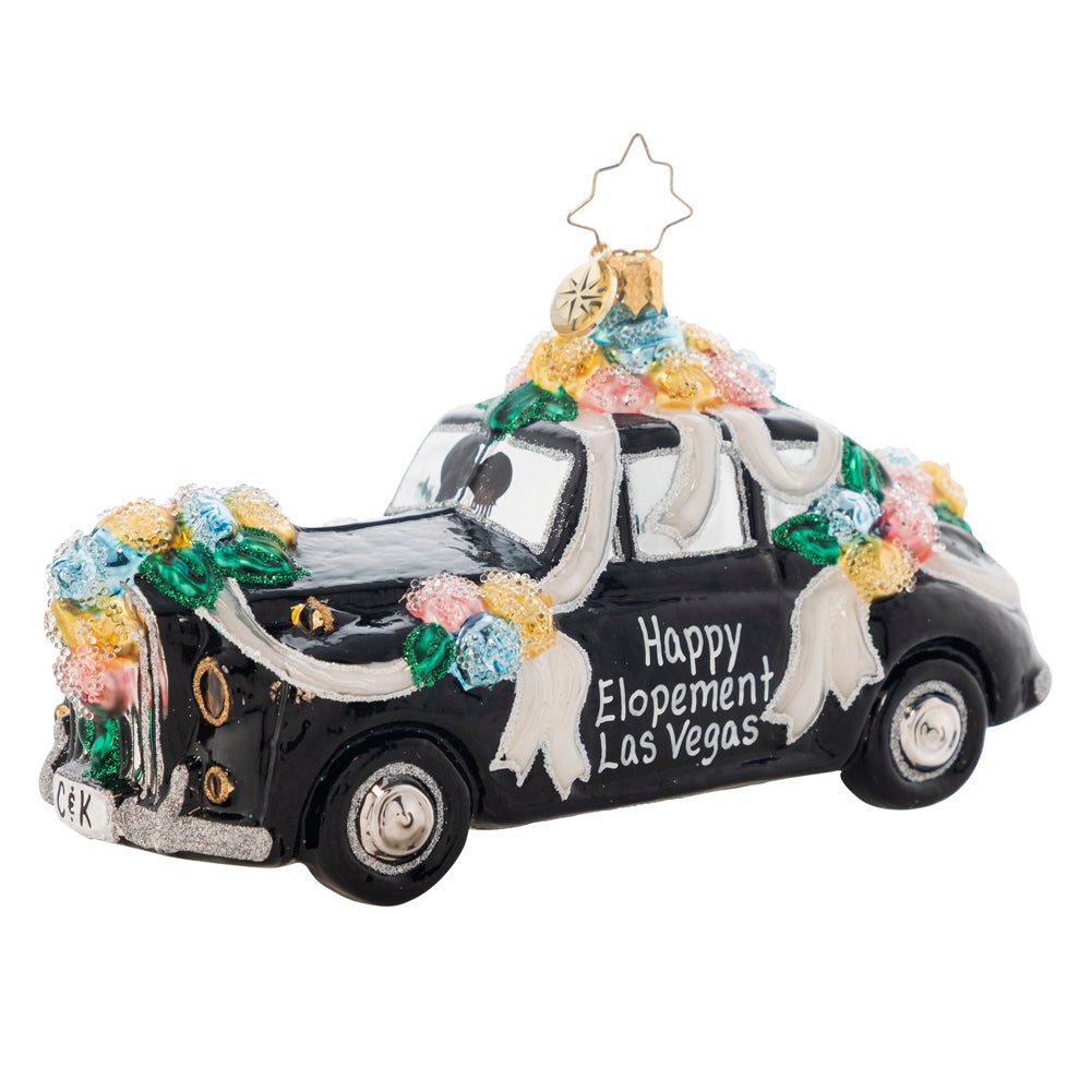 Front Side View - Ornament Description - Heading to the Chapel: Dashing to their romantic honeymoon hideaway, the couple within this ritzy racer clearly have an eye for the elite. Add the names of the newest couple in your life to the doors of this vintage vehicle. It will make a one of a kind gift to commemorate a wonderful occasion. Note: Please allow approximately one month (on top of shipping time) for our elves to personalize your ornament.