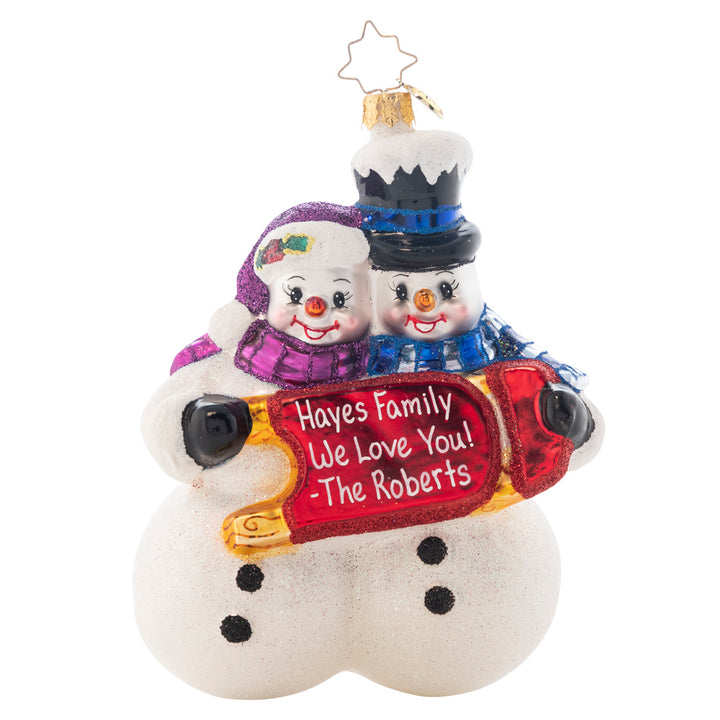 Ornament Description - Winterland Fun: This lovely snow couple are hoping excitedly for a white Christmas. Judging from the snowy layer on the top hat, they'll probably get their wish! Add your own personal message or your family's name to the front of this snow couple's sleigh. Note: Please allow approximately one week (on top of shipping time) for our elves to personalize your ornament.