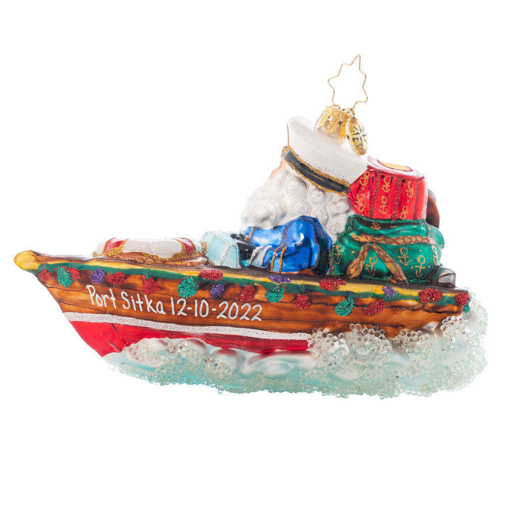 Back - Ornament Description - Nautical Nick: Kris is cruising in his sleek speed boat. He proudly wears his captain's hat beside his first mate. Lobster anyone? Add a name on the side of Santa's boat to create a one of a kind ornament. Note: Please allow approximately one month (on top of shipping time) for our elves to personalize your ornament.