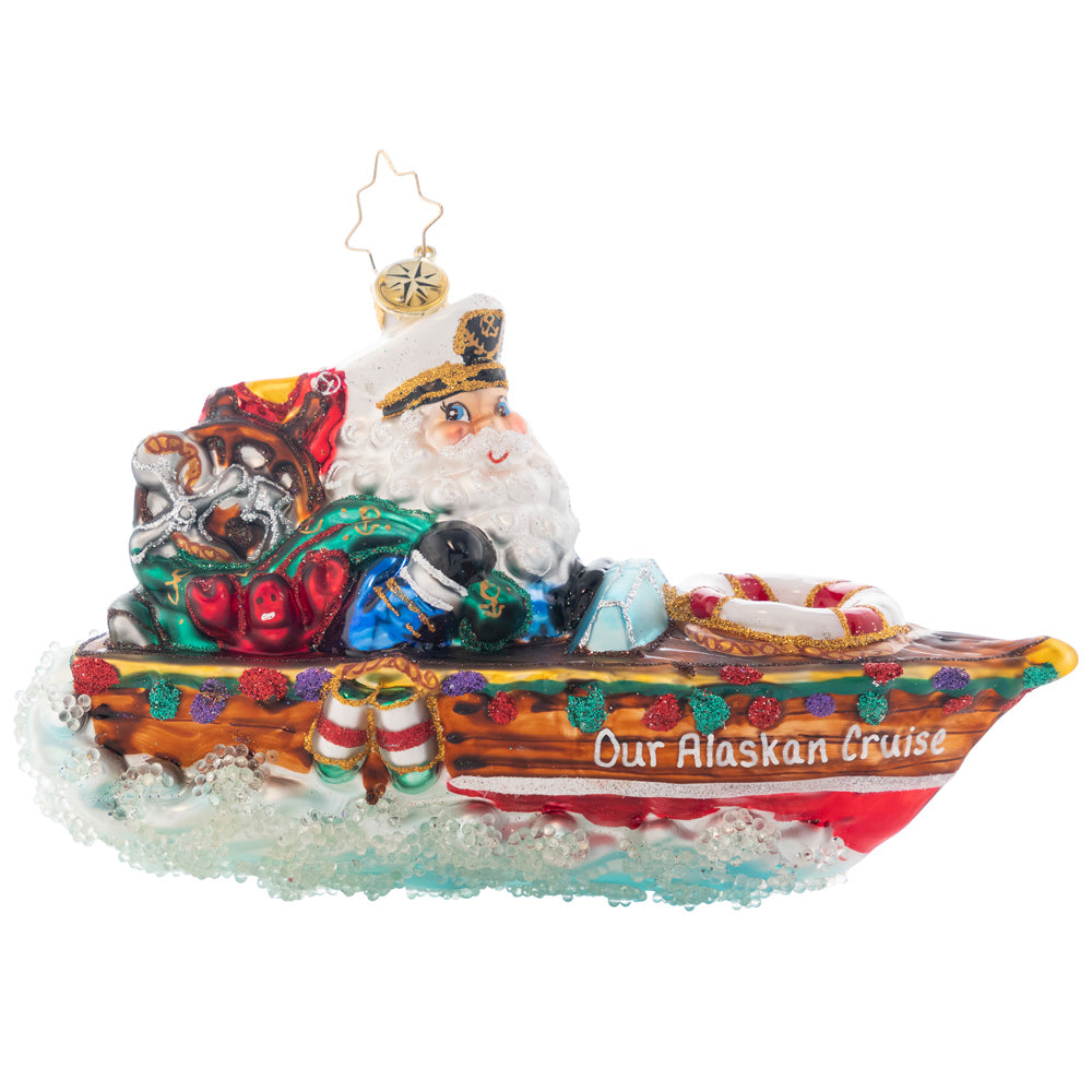 Ornament Description - Nautical Nick: Kris is cruising in his sleek speed boat. He proudly wears his captain's hat beside his first mate. Lobster anyone? Add a name on the side of Santa's boat to create a one of a kind ornament. Note: Please allow approximately one month (on top of shipping time) for our elves to personalize your ornament.