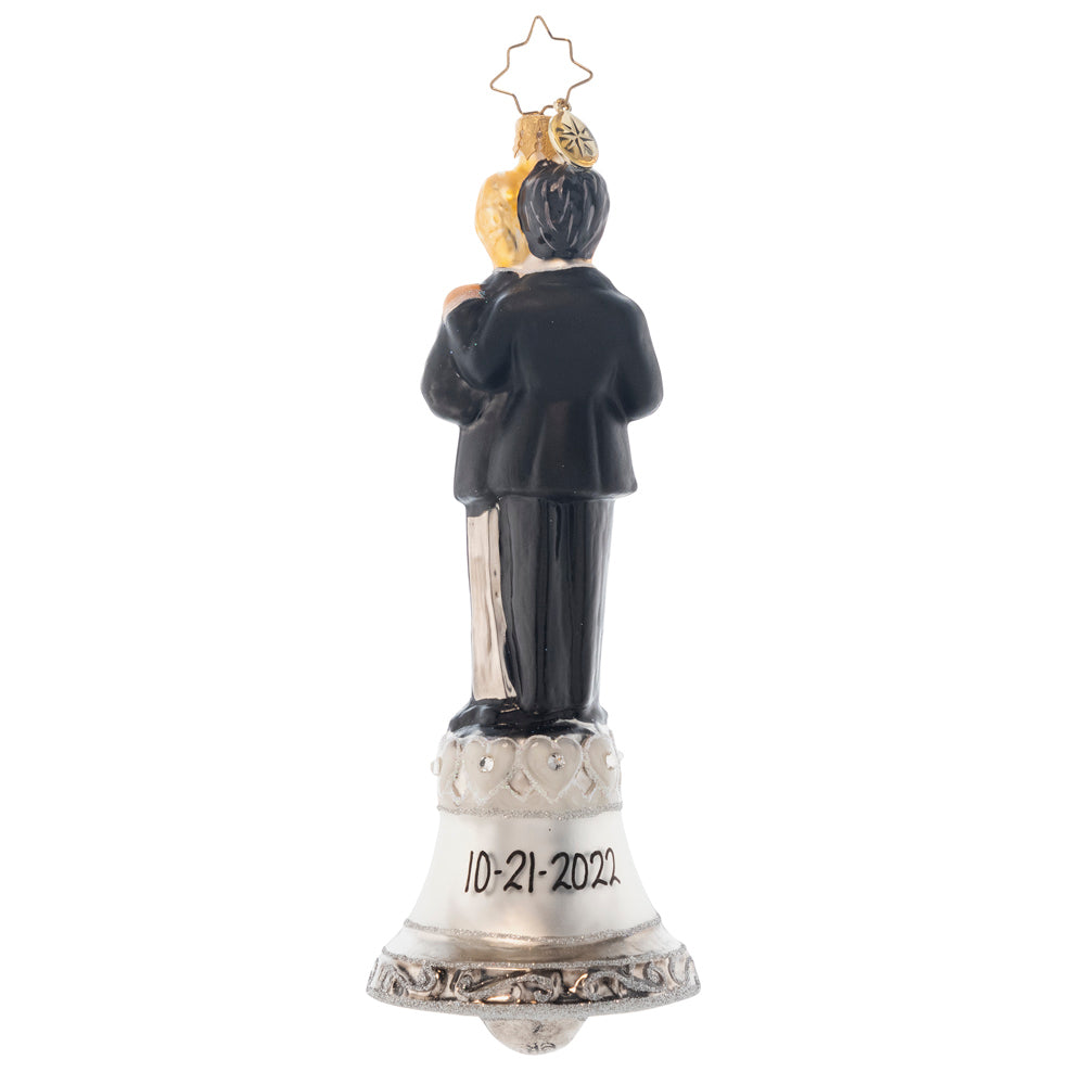 Back - Ornament Description - Dedicated Devotion: These two gentlemen are dedicated to each other and ready to start the first day of the rest of their lives! Ring the bell, celebrating this loving couple and sending them on their new path together! Note: Please allow approximately one month (on top of shipping time) for our elves to personalize your ornament.