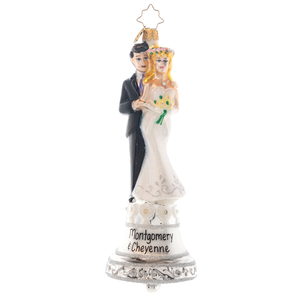 Front - The flowers have been tossed, the wedding bells have rung! This couple is finally hitched, and the good times have only just begun. Note: Please allow approximately one month (on top of shipping time) for our elves to personalize your ornament.