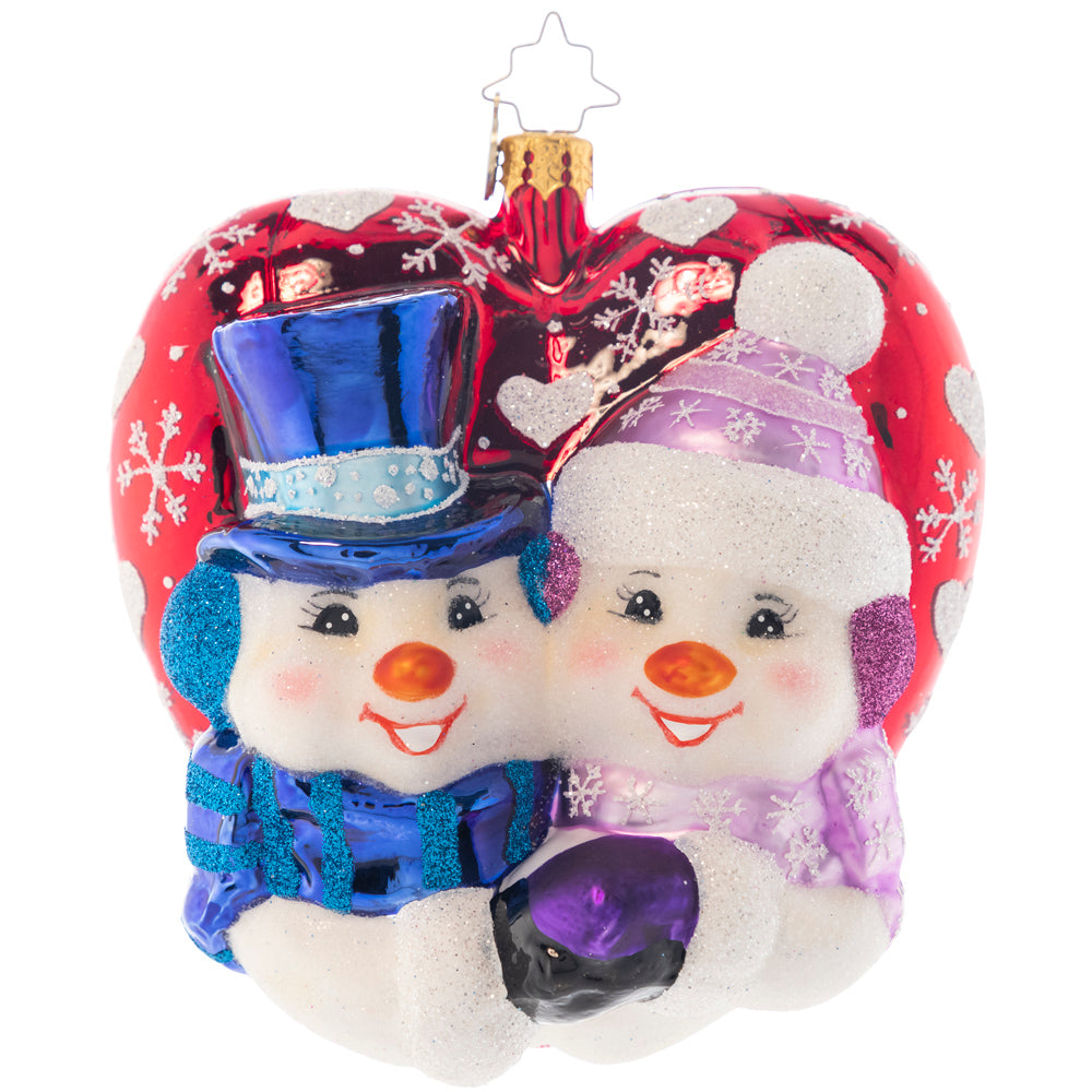 Ornament Description - A Frosty First Christmas Personalized: They may be made of snow, but they have got their love to keep them warm! This heart-shaped ornament celebrates new love and the thrill of a first holiday spent together. Note: Please allow approximately one month (on top of shipping time) for our elves to personalize your ornament.
