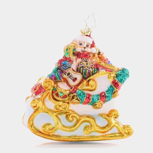 Video - Ornament Description - Santa's Gilded Glider: Gilded with gold and abounding with glorious gifts, this sleigh is a special sight to see the night before Christmas. This video shows the ornament spinning slowly. 