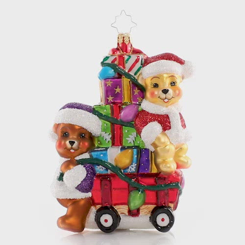 Video - Ornament Description - Toting Treasure Teddies: Wishing you a very bear-y Christmas! These precious plushies are riding in style on their little red wagon piled high with toys and Christmas joy! This video shows the ornament spinning slowly. 