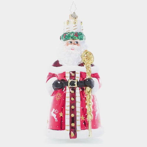 Video - Ornament Description - God Jul Santa: This Santa wears a crown of candles and a shiny red robe adorned with a delicate white pattern reminiscent of traditional Nordic Christmas motifs, paying homage to the Scandinavian feast of Santa Lucia. This video shows the ornament slowly spinning. 