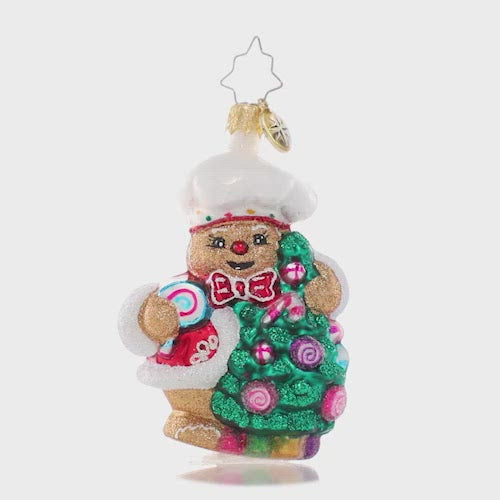 Video - Ornament Description - Edible Evergreen Dream Gem: This smiling gingerbread baker has whipped up a batch of his specialty – Christmas candy ornaments for his tree! He can't wait to celebrate his favorite season with all his gingerbread friends! The video shows this ornament slowly spinning. 