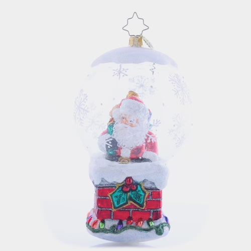 Video - Ornament Description - Up On The Housetop: It's a bit of a tight squeeze for Santa to fit down the chimney – not because he's been eating Christmas cookies, but because of his bountiful bag of gifts, of course! This video shows the ornament spinning slowly. 