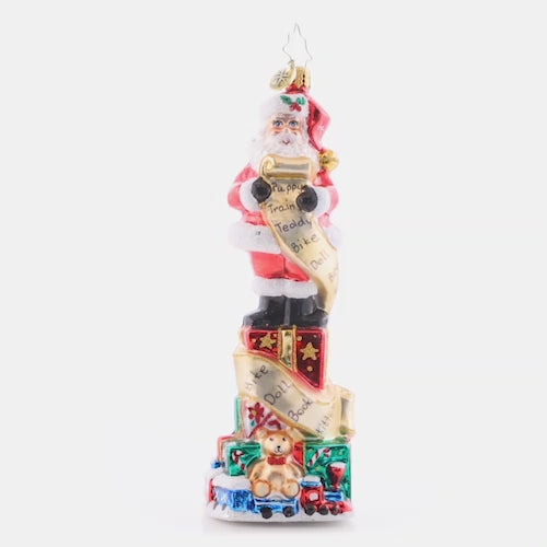 Video - Ornament Description - Stacked Up Santa: Quite a lengthy wish list this child sent in! Much time and consideration was spent filling it in. Santa has to stand on many presents stacked to check off each gift as they're carefully packed. This video shows the ornament spinning slowly. 
