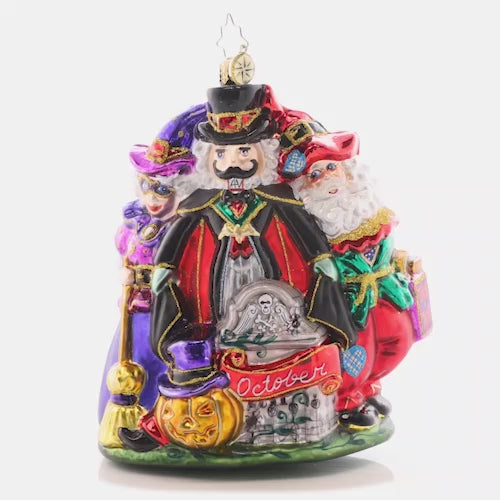 Video - Ornament Description - Happy Hauntings: It's looking like a holiday-themed Halloween! Santa, Mrs. Claus, and a spooky nutcracker celebrate with fright and delight for the tenth piece in our Ornament of the Month collection. This video shows the ornament slowly spinning. 