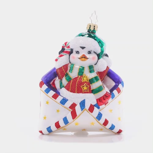 Video - Ornament Description - Penguin Delivery: You've got mail – and an adorable penguin pal! This flightless friend will make sure your Christmas list arrives safely to the North Pole in time for the holiday season. This video shows the ornament spinning slowly. 