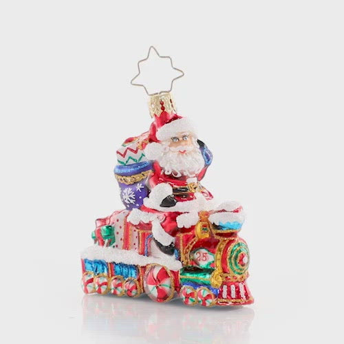 Video - Ornament Description - On the Tracks Santa Gem: Choo chooâ€”it is the Holiday Express! Santa is all aboard on this little locomotive, on his way to spread Christmas cheer to one and all. This video shows the ornament spinning slowly. 