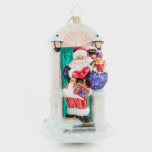 Video - Ornament Description - Knock, Knock... Santa Is Here!: When there is no chimney, use the front door! A stunning Christmas tree awaits Santa just across the threshold of this holiday home. This video shows the ornament slowly spinning. 