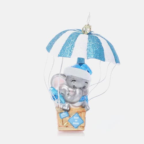 Video - Ornament Description - Bundle of Joy Baby: Baby on board! Welcome the newest little one in your life with this adorable ornament featuring a sweet baby elephant floating in on a blue and white air mail parachute.