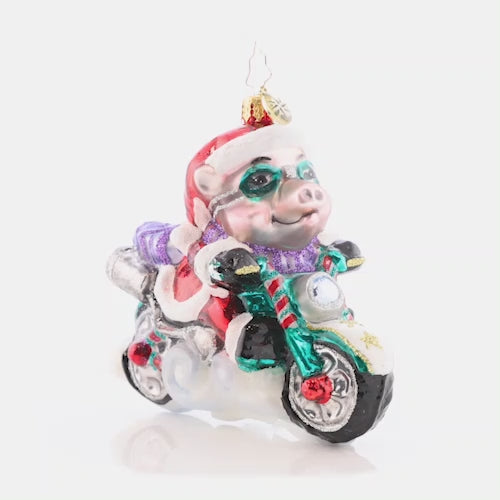 Video - Ornament Description - Low Rider Hog: That's one speedy swine! This biker Santa is bad to the bone, cruising along the highway on a holiday hog. This video shows the ornament slowly spinning.