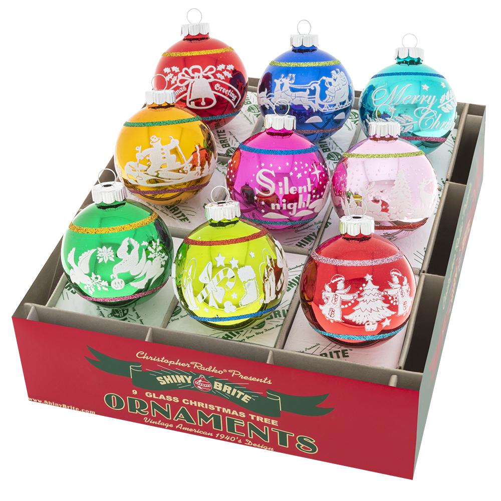 Ornaments - Description: Christmas Confetti 9 Count 2.5" Signature Flocked Rounds - These nine glass rounds stand out in vibrant, vintage-inspired designs that feature snowy scenes and nostalgic good tidings.