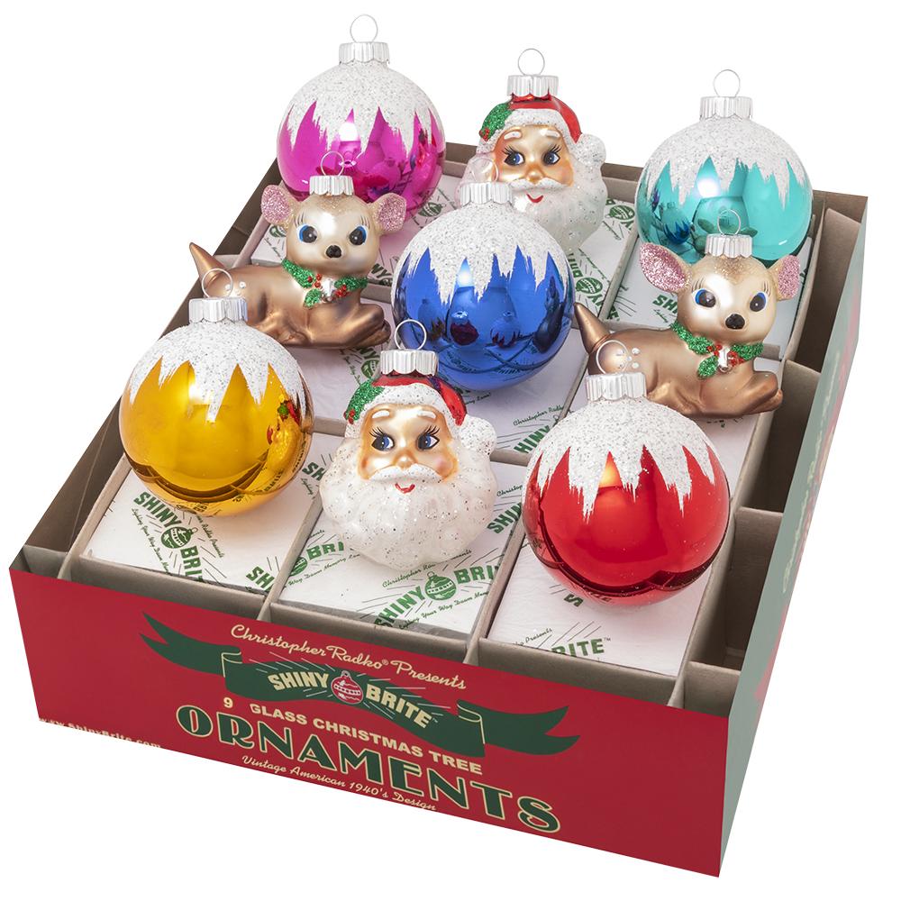 Ornaments - Description: Christmas Confetti 9 Count 2.5" Rounds & Santas & Deer - Between the "snow" capped glass rounds, the adorable reindeer and Santa's cheery grin It doesn't get much more charming than this nine-count set!