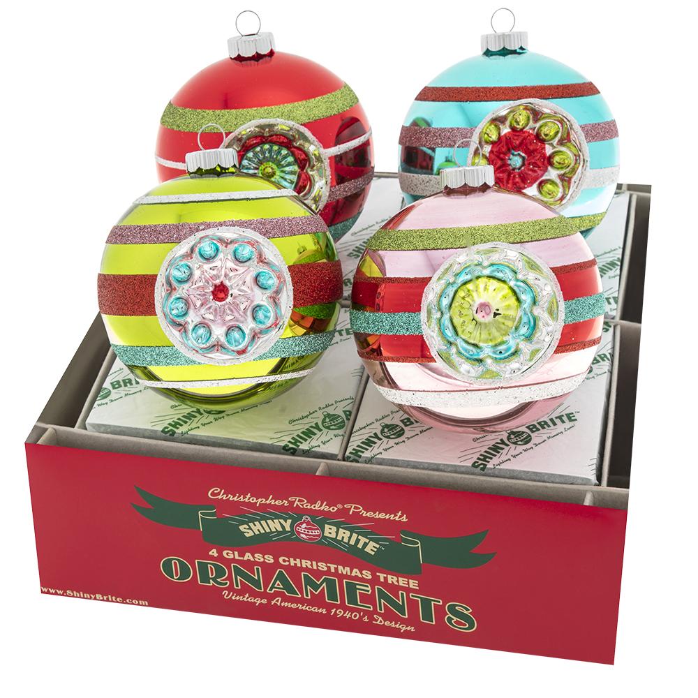 Ornament Description - Festive Fete 4 Count 4" Rounds With Reflector: Four reflective glass rounds are decorated in signature retro style, sure to add a touch of vintage-inspired glitz to your tree!